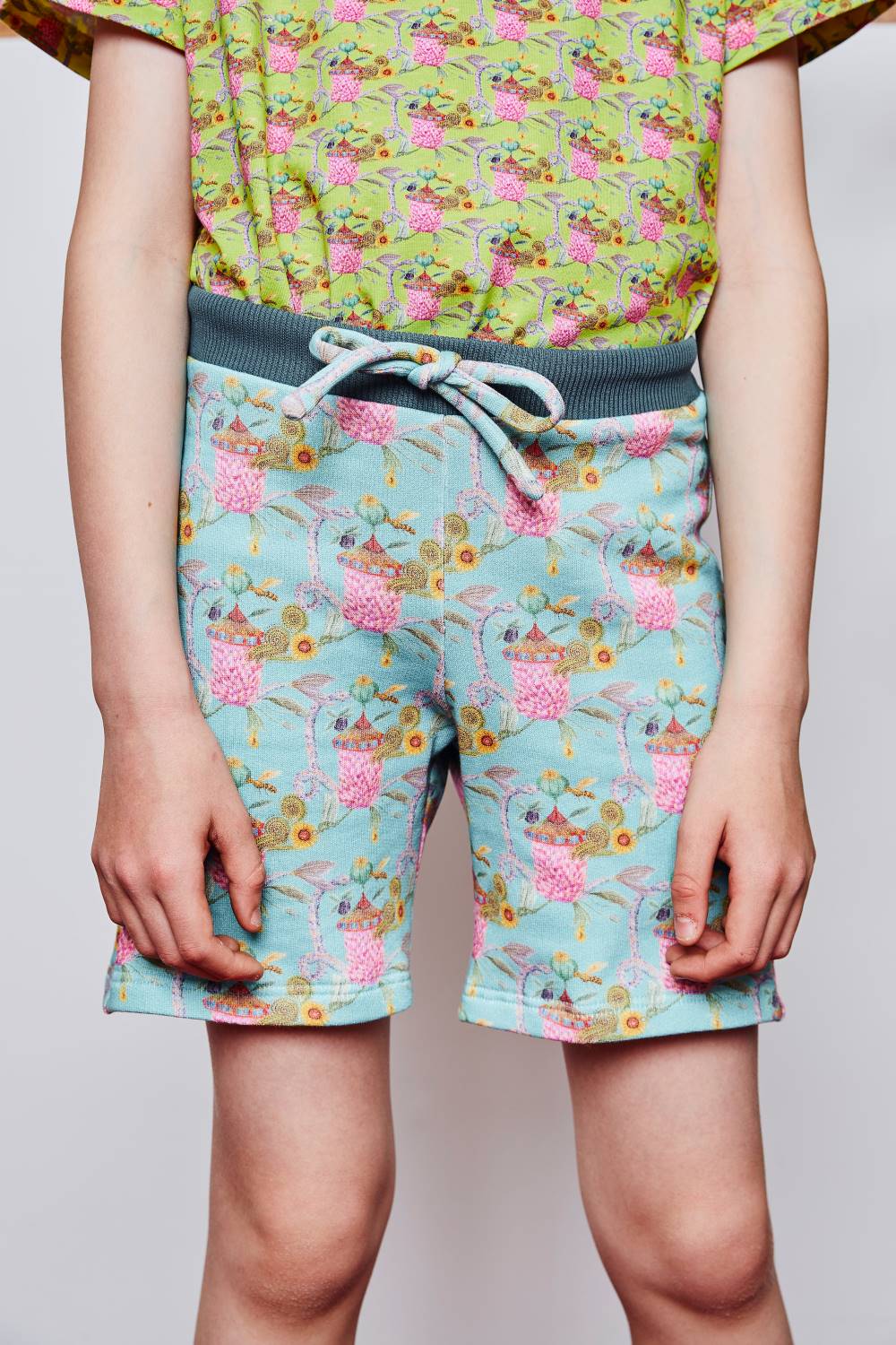 Ten years old boy wearing printed organic cotton sweat kids shorts by aesthete-(kids)wear.