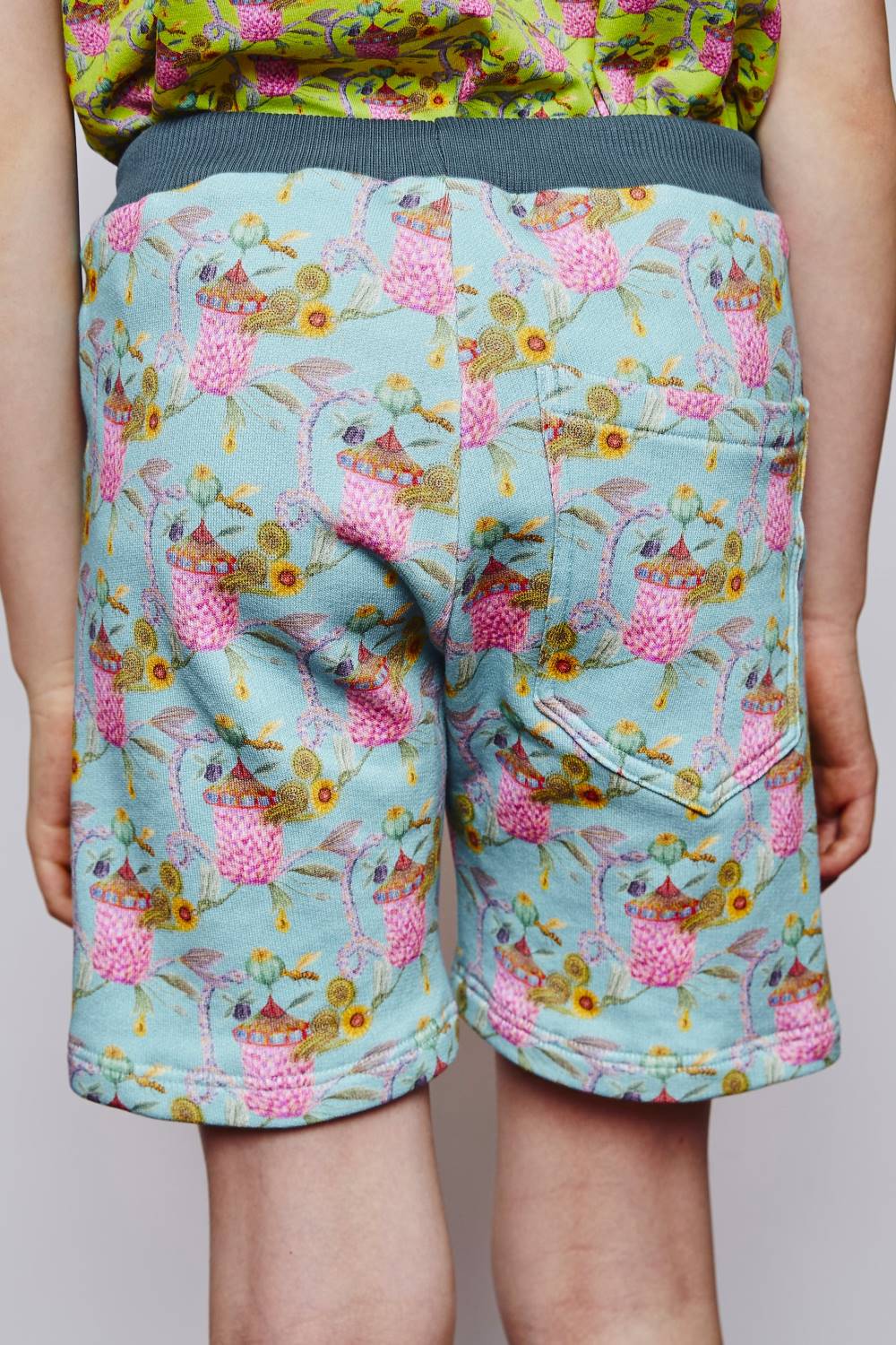 Ten years old boy wearing printed organic cotton sweat kids shorts by aesthete-(kids)wear.