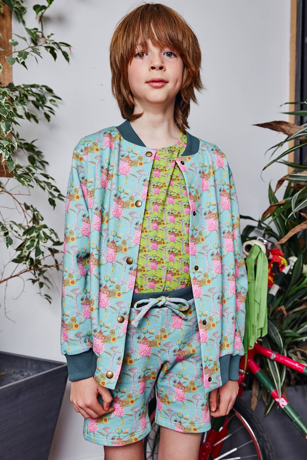 Ten years old boy wearing printed organic cotton kids outfit by aesthete-(kids)wear.