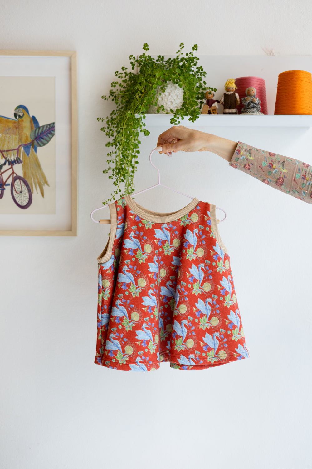 Kids organic cotton flared sweater vest.