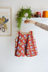 Kids organic cotton flared sweater vest.