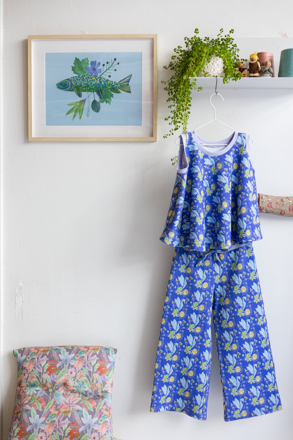 Kids organic cotton flared sweater vest and pants.