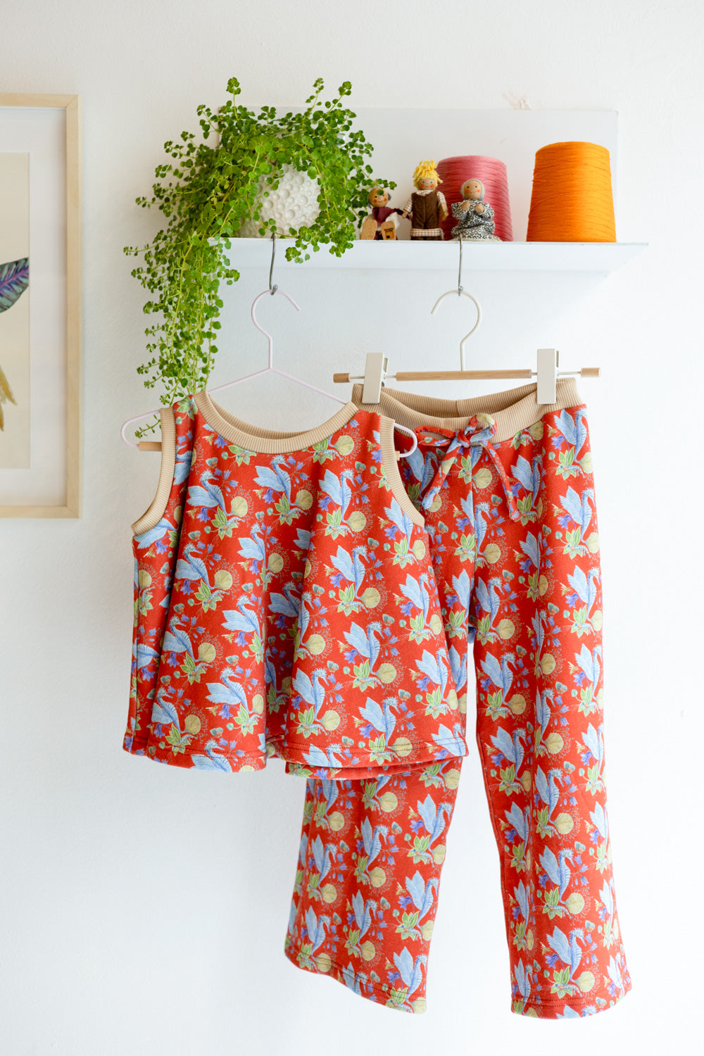 Kids organic cotton sweat pants and flared sweater vest.
