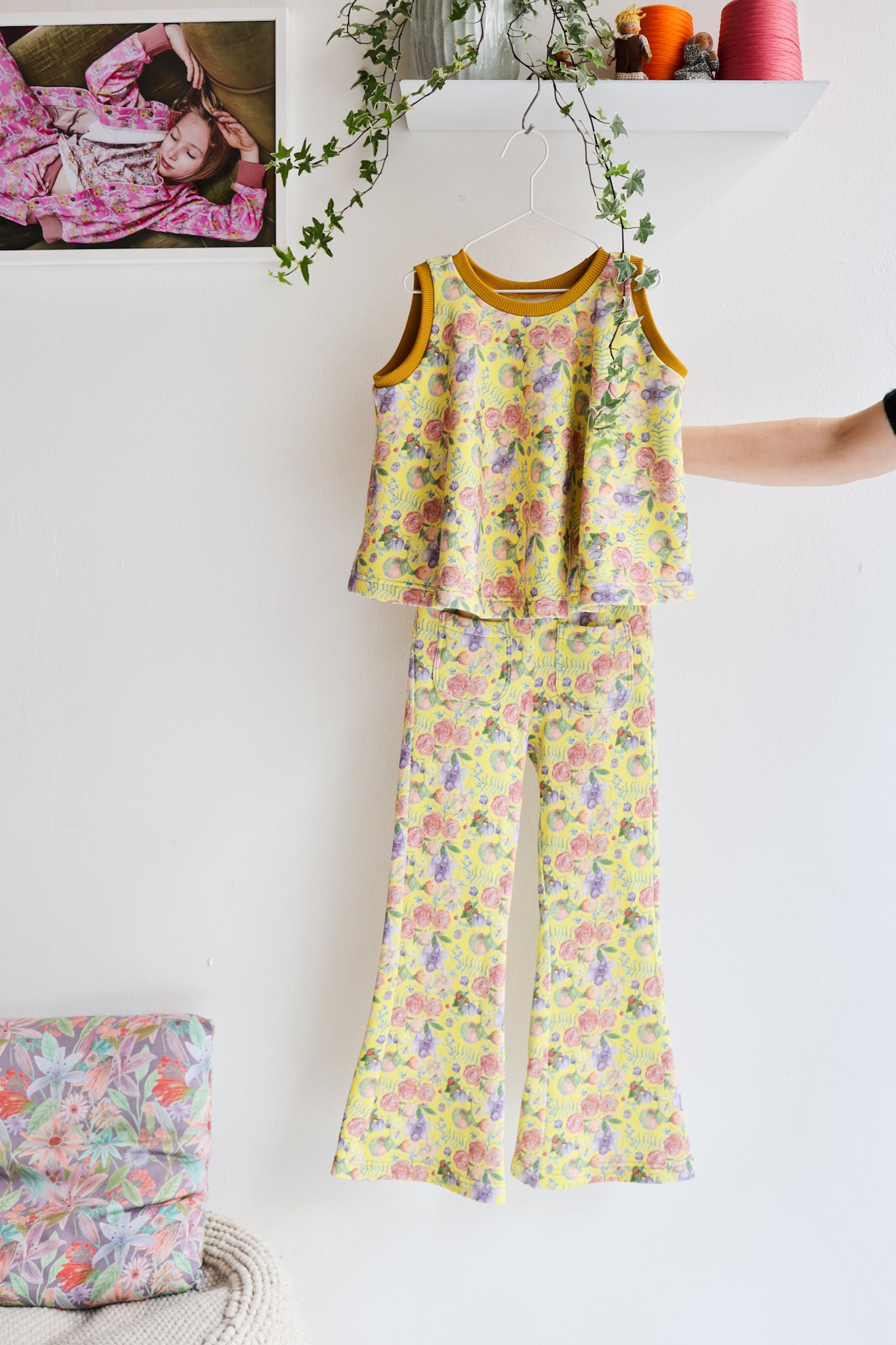 Kids flared sweater vest and bell bottom pants.