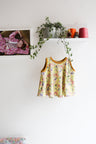 Kids organic cotton flared sweater vest.