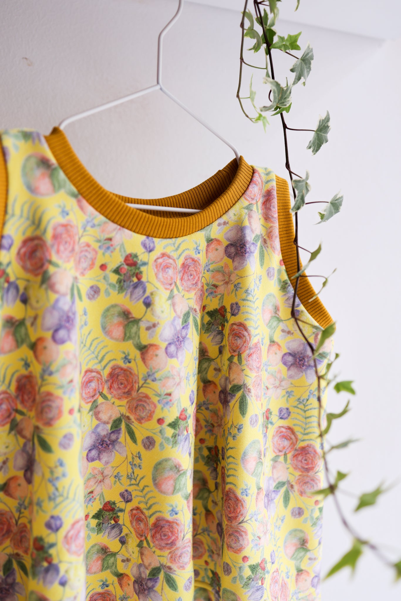 Kids organic cotton flared sweater vest.