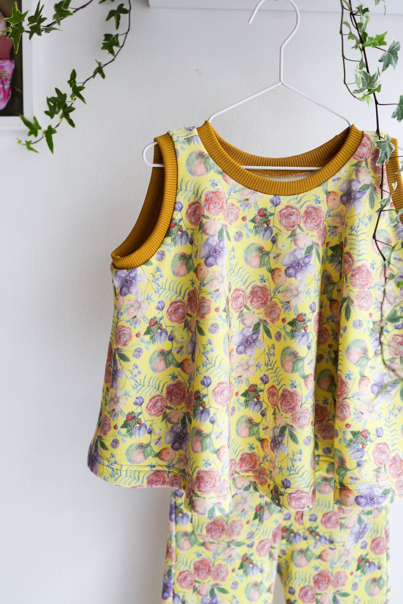 Kids organic cotton flared sweater vest.