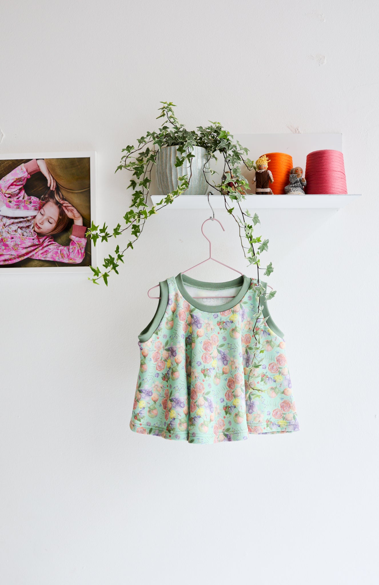 Kids organic cotton flared sweater vest.