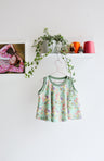 Kids organic cotton flared sweater vest.