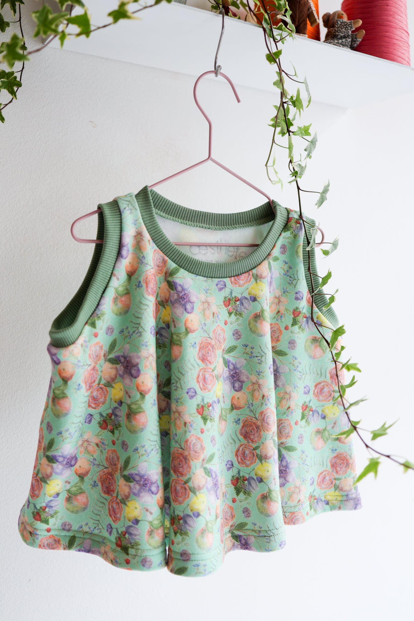 Kids organic cotton flared sweater vest.