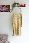 Kids long sleeve extra flared slip dress.