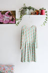 Kids long sleeve extra flared slip dress.