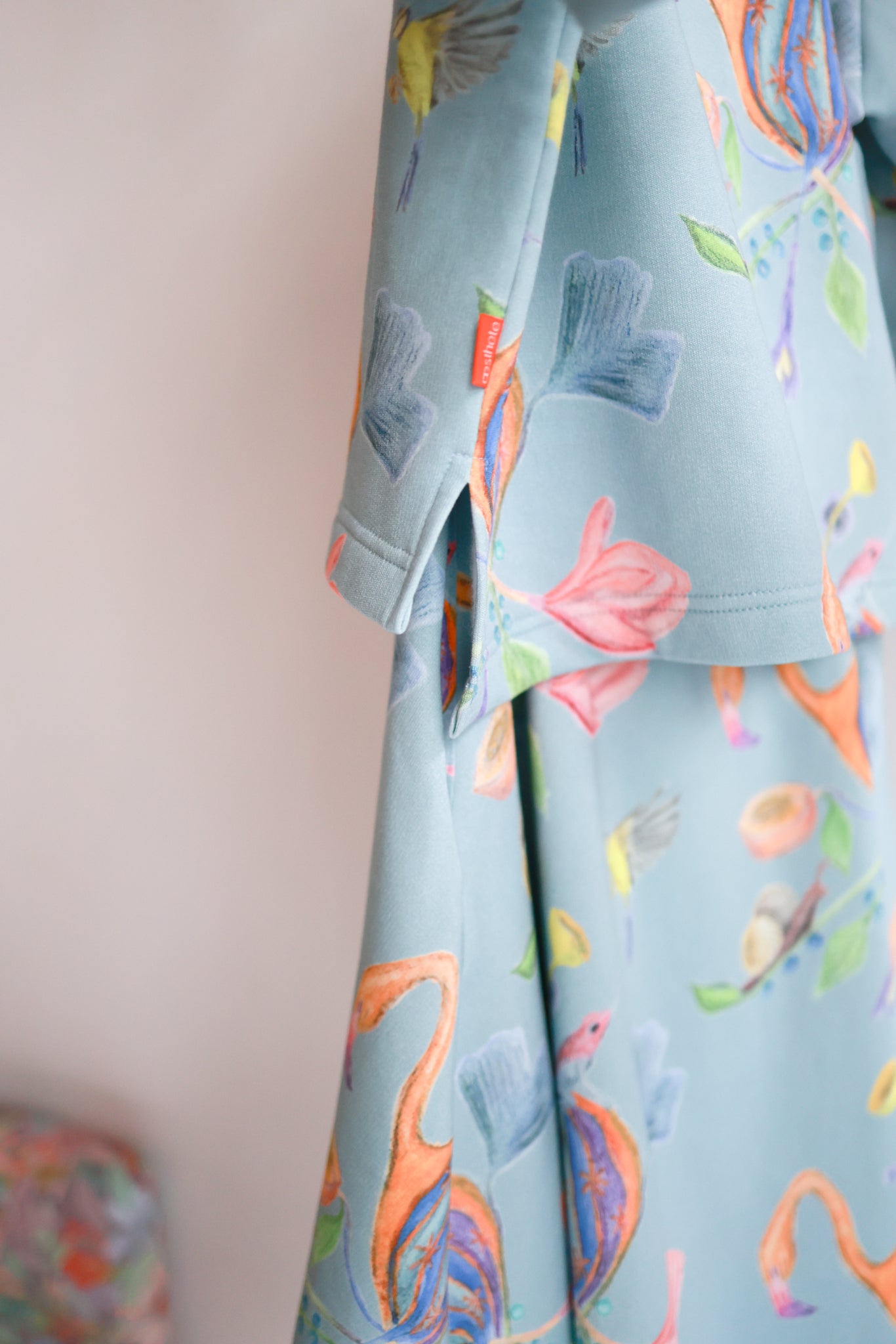 Kids organic cotton slitted sweatshirt and flared skirt.