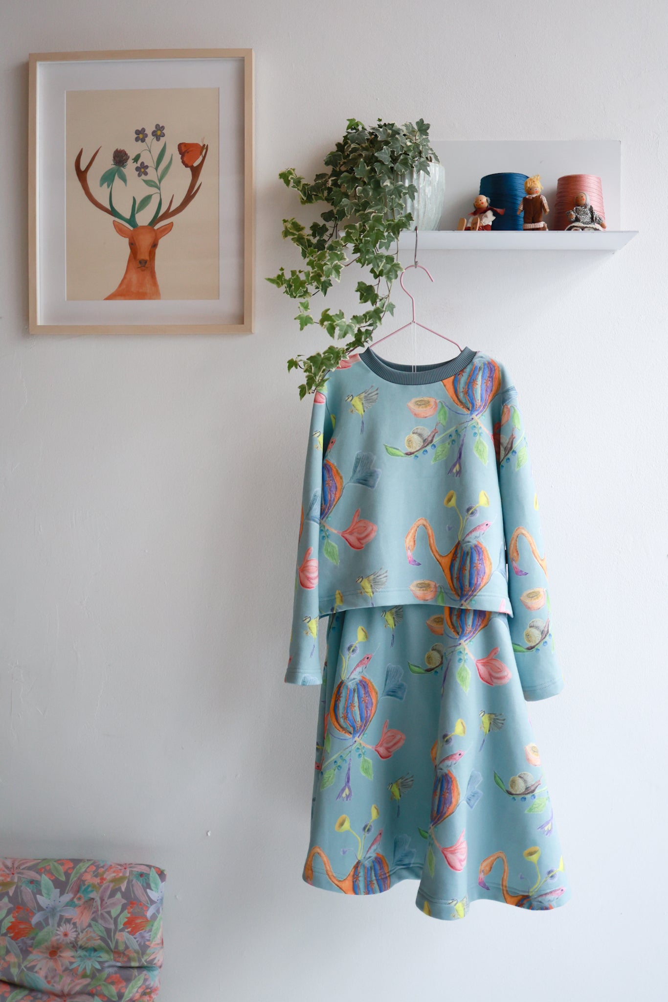 Kids organic cotton slitted sweatshirt and flared skirt.