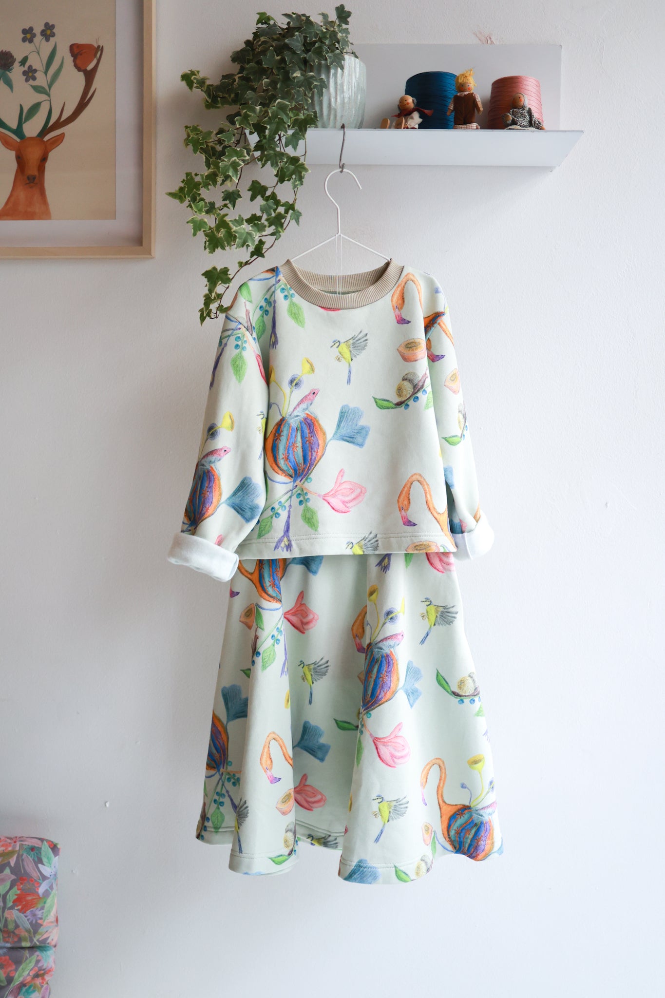 Kids organic cotton slitted sweatshirt and flared skirt.
