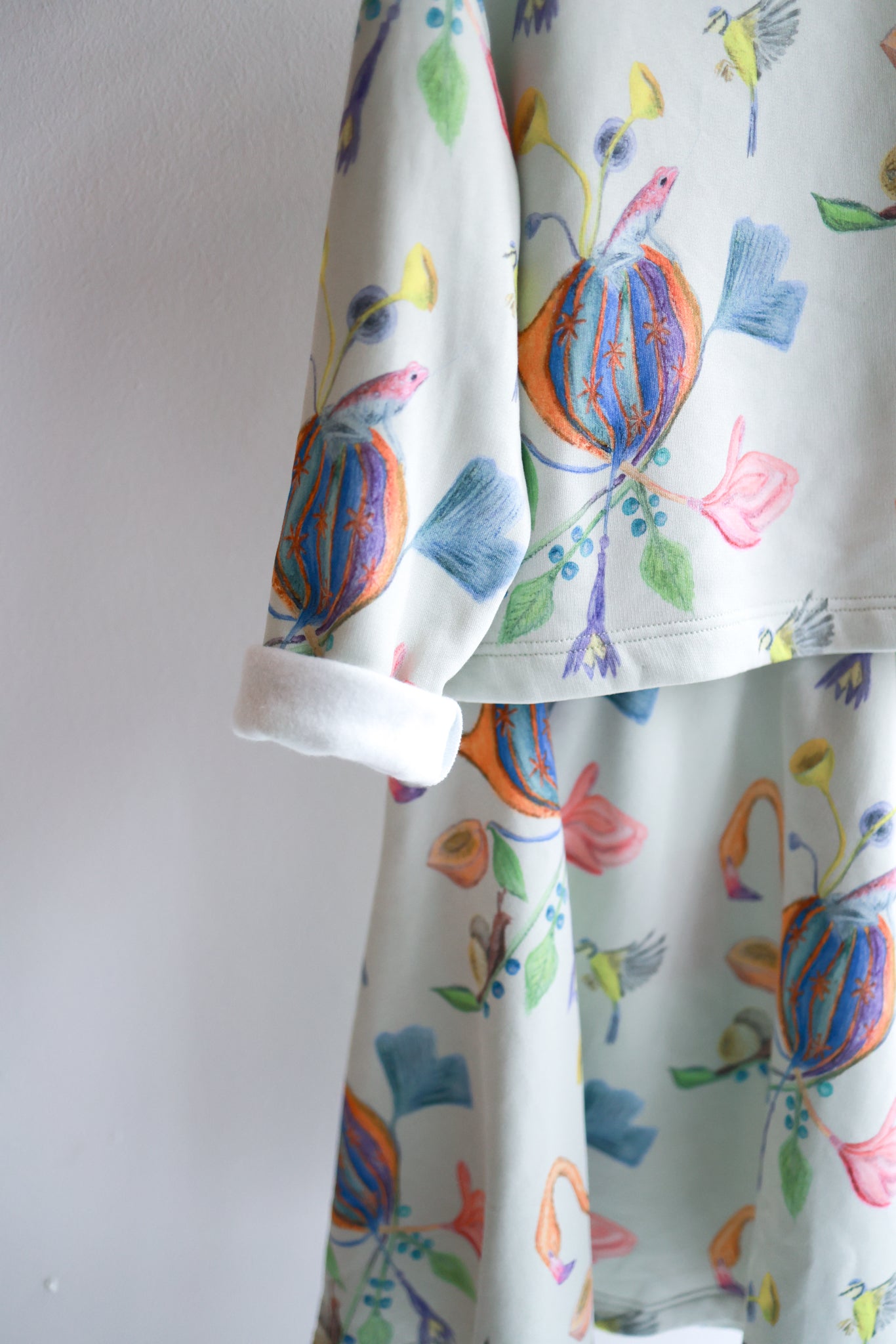 Kids organic cotton slitted sweatshirt and flared skirt.