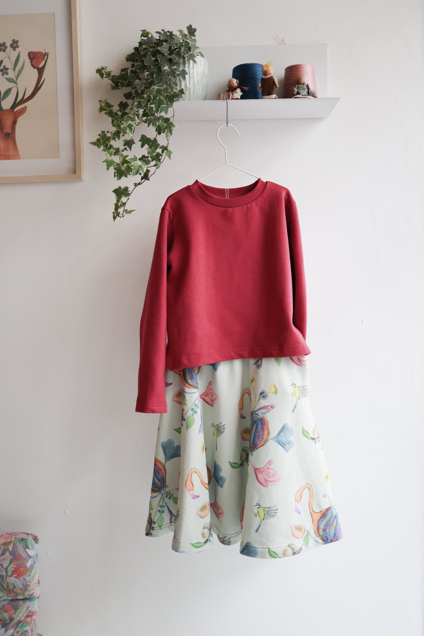 Kids organic cotton slitted sweatshirt and flared skirt.