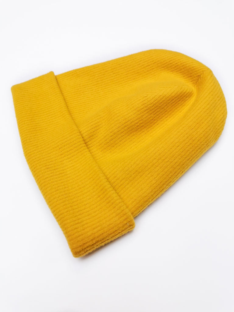 "Dreaming Softly" organic cotton beanie by aesthete kidswear. Color: Golden yellow.